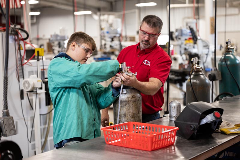 Students learn manufacturing while doing jobs for customers.